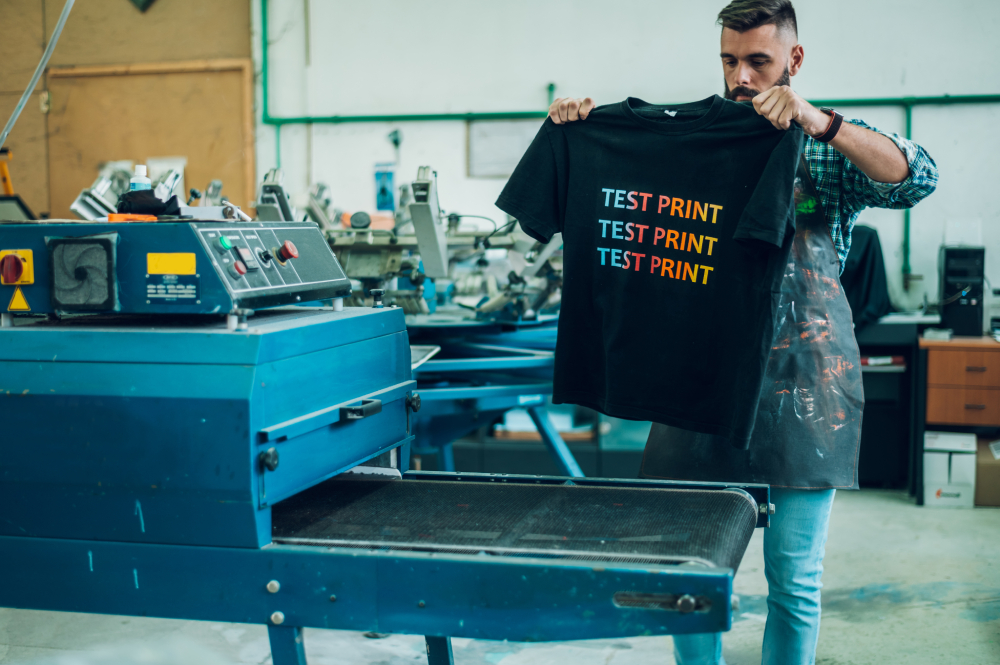 Man holding T-shirt test print